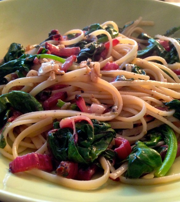 Absolutely gorgeous swiss chard (with stalk) sauteed with lots of garlic and scallions with  a simple olive oil and pecorino romano sauce over linguine.